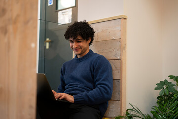 Man working on laptop in office