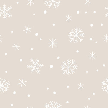Winter snow vector seamless pattern. Minimalist scandinavian repeat background with abstract snowflakes in beige and white colours.