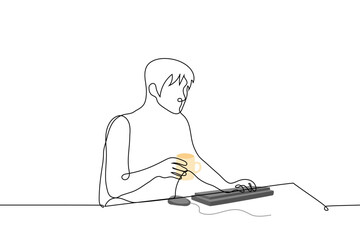 man holding mug sitting at computer - one line drawing vector. concept freelancer drinks tea from a mug while working