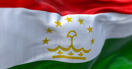 Close-up view of the Tajikistan national flag waving in the wind