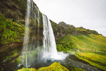 Wide angle shot behind of Majestic Gljufrafoss waterfall in Iceland