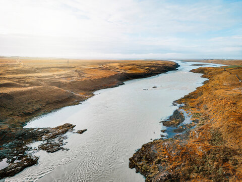 Ice Blue Glacier River In Iceland Frome Above