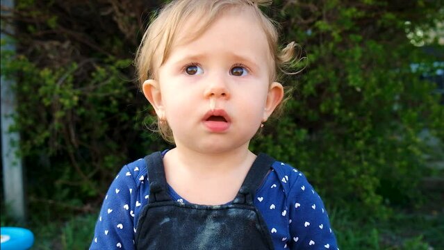 The child has snot on his face. Selective focus.