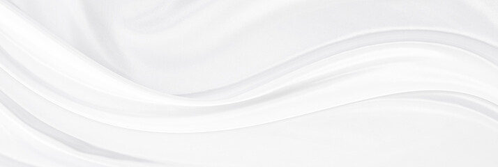 White gray satin texture that is white silver fabric silk panorama background with beautiful soft blur pattern natural.