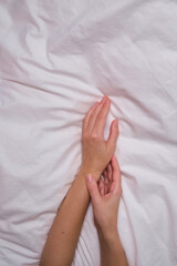 Beautiful female hands on a light background. Aesthetics of minimalism. The concept of spa, wedding salons, hand treatments
