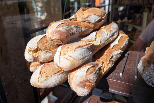 French bakery, many fresh baked baguettes breads ready for sale close up