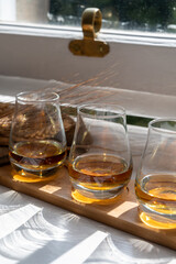 Flight of single malt scotch whisky served on old wooden window sill in Scottisch house in Edinburgh, Scotland, UK