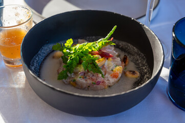 Tartare of seabass with mango, passion fruit and coconut milk