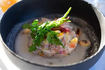 Tartare of seabass with mango, passion fruit and coconut milk