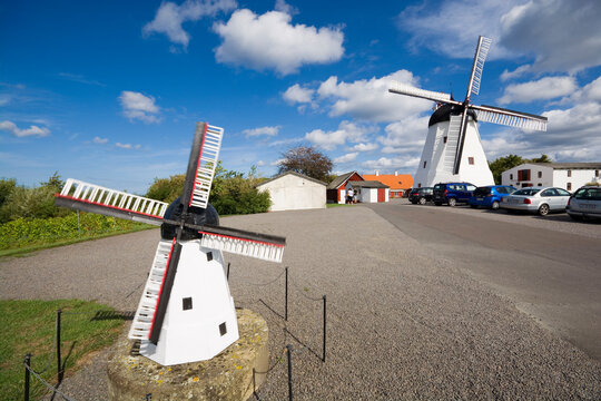 Still working Dutch-type windmill built in 1877 and its miniature in Aarsdale, Bornholm island, Denmark