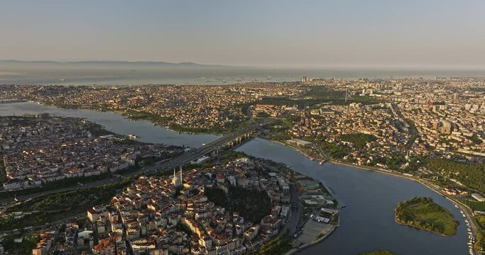 Istanbul Turkey Aerial v36 flyover beyoğlu towards ey&uuml;psultan capturing busy traffic on hali&ccedil; bridge across golden horn and vast expanse of marmara sea at sunrise - Shot with Mavic 3 Cine - July 2022