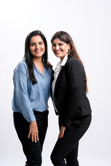 Young confident indian businesswoman standing on white background.