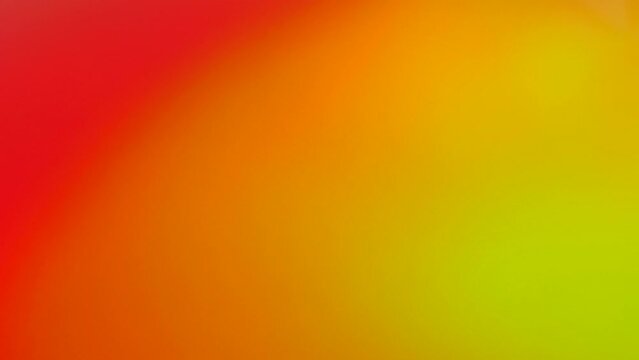 Soft and warm orange, yellow and red bruised color gradient background.