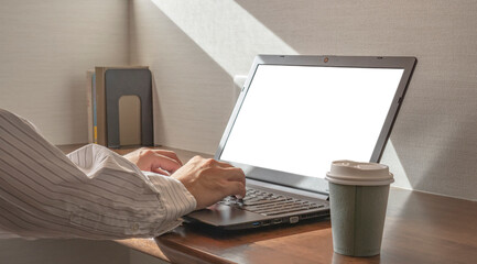 A man using computer at home or hotel. 自宅またはホテルでパソコンを使う男性