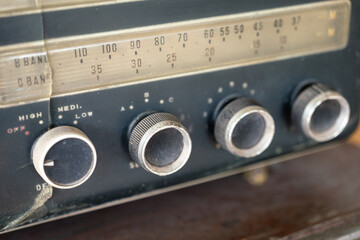 Wave signal frequency panel part of the ancient transistor radio device. Close-up and selective focus.	