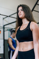 Fototapeta na wymiar Bodybuilder woman lifting weights at the gym.