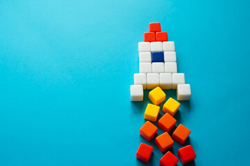 Rocket on takeoff. Creative from colored blocks. Create a business startup. Crowdfunding...