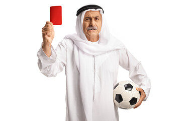 Arngry aab man in ethnic clothes holding a football and showing a red card