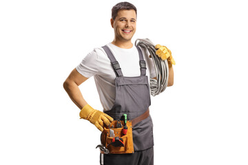 Electrician carrying cables on his shoulder and smiling