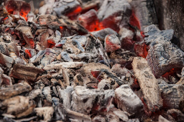 Flaming Charcoal In BBQ Grill Pit Isolated On Black Background