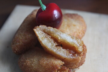 Misro is a food made from grated cassava which is filled with brown sugar inside and then fried.