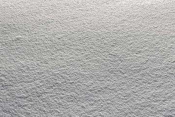 Smooth surface of the fallen snow. Natural snow color and texture