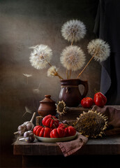 Rustic still life with tomatoes, dandelions and sunflowers © 02irina