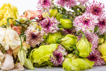 Withered flowers. Withered chrysanthemums. Withered eustoma. Bouquet of withered flowers.