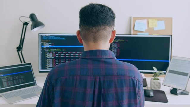 Young Asian man, developer programmer, software engineer, IT support, working on computer to check coding in bugging system