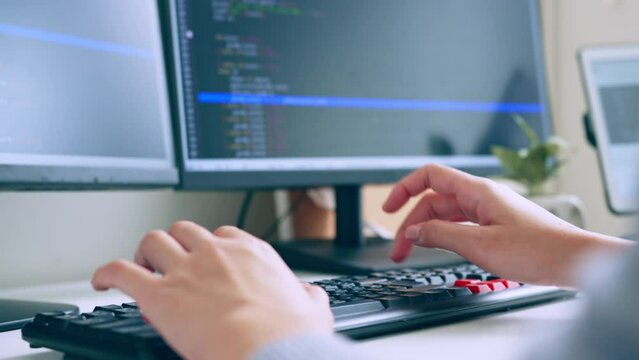 Closeup hand of developer programmer, software engineer, IT support, typing on computer keyboard