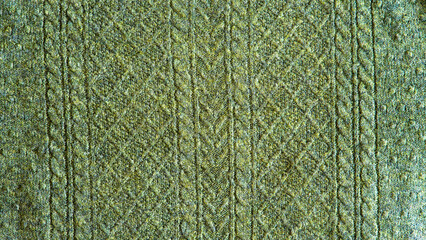 Knitted seamless background with copyspace. Blue and green sweater pattern for Christmas or winter design. 