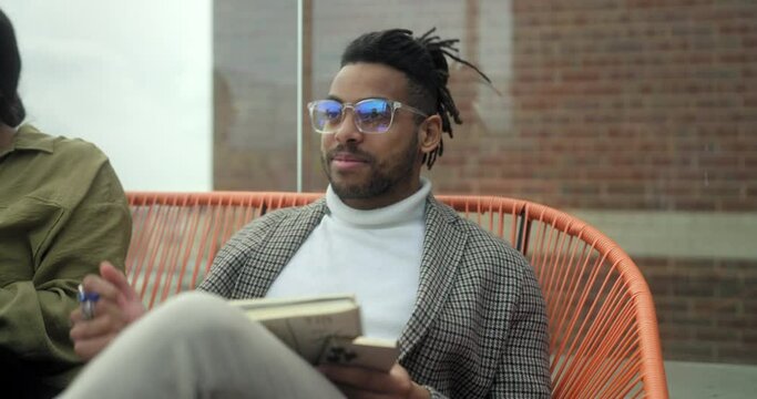 Employees having meeting on terrace