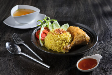 Close up view of yummy chicken with rice on grey background
