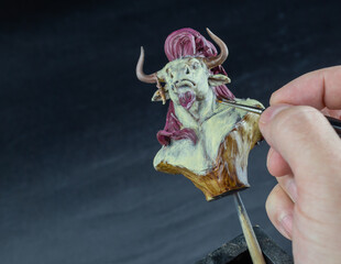 Painting a bust of a minotaur 