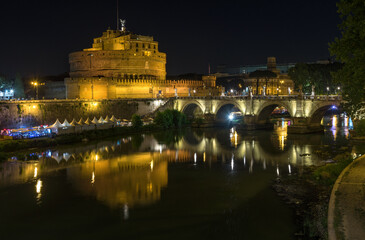 Fototapeta na wymiar Night view on Sant'Angelo castle and the bridge from Tiber river