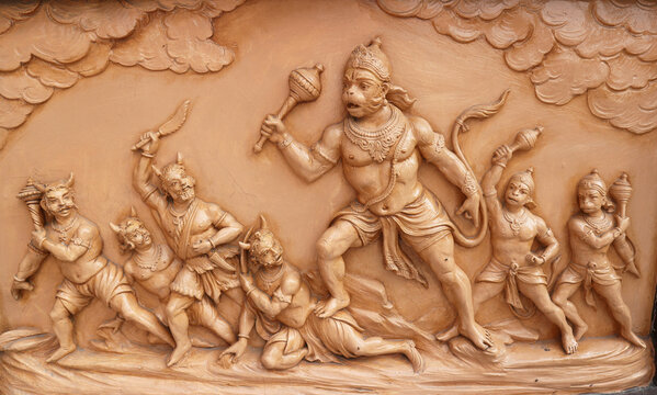 Hanuman fights demons. A story from the Ramayana on a temple wall in Rishikesh, Uttarakhand, India