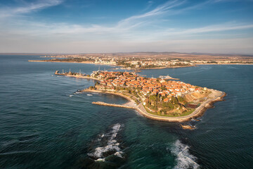 Aerial view of Nessebar, an ancient town on the Bulgarian Black Sea coast with red-roofed houses...