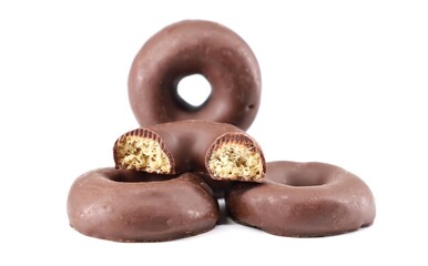 Chocolate glazed donuts on white background.