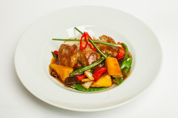 Rice with meat and vegetables in tomato sause on white