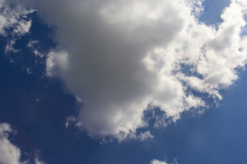 clouds in the sky lit by the sun on a summer day. background