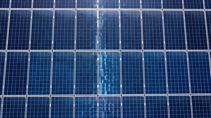 Overhead aerial view showing the texture of solar panels from above.
