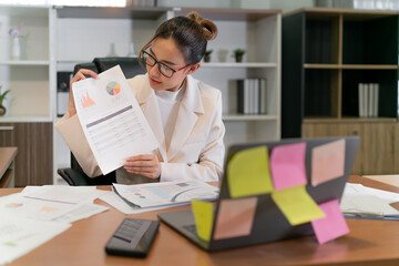 Fototapeta premium Business woman happy to present work digital online. professional female worker showing paper sheet information to online meeting team. office employee show work plan to internet video business group