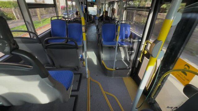 Germany. Munich. City bus on route, filmed inside the interior in sunny weather, almost empty. Public transport in Muenchen. MVV. Urban transport in the Bavarian Deutschland region. 