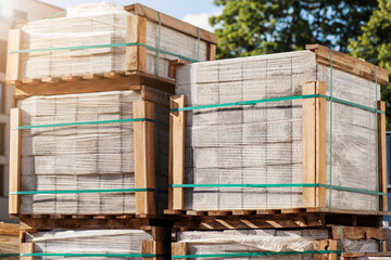 Paving Stones Pallets for Road Construction. Paving Slabs Stacked  in Construction Site for Laying...