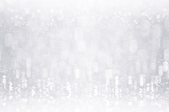 Abstract white sparkle glam snow crystal background or silver glitter pattern