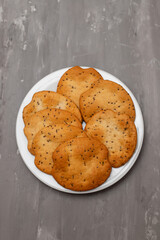 butter cookies isolated on light brown plate