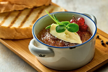 Pate with jam and butter in a plate. Close-up, selective focus