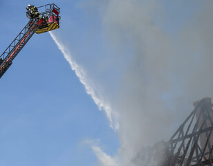 firefighter in action on the large scale	