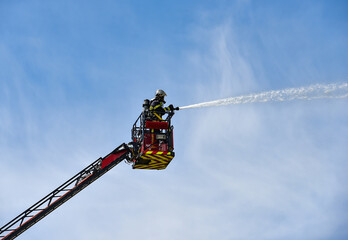 firefighter in action on the large scale	