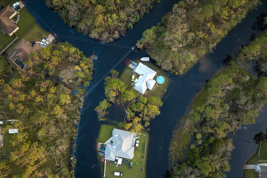 Flooded houses by hurricane Ian rainfall in Florida residential area. Consequences of natural disaster